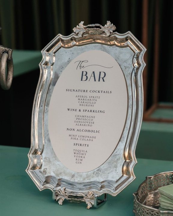 Illustrated wedding bar menu in a silver frame